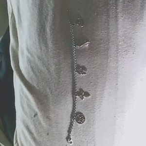 1 lady's charm bracelet with 5 different charms